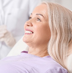 patient smiling after getting dental implants in Newington