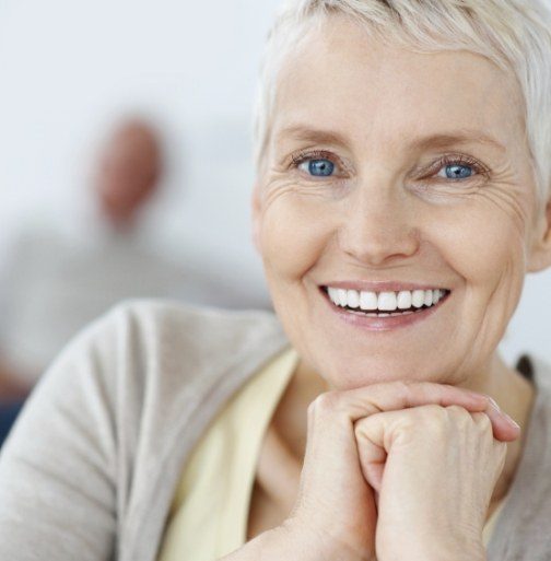 Woman with healthy smile after dental bone grafting