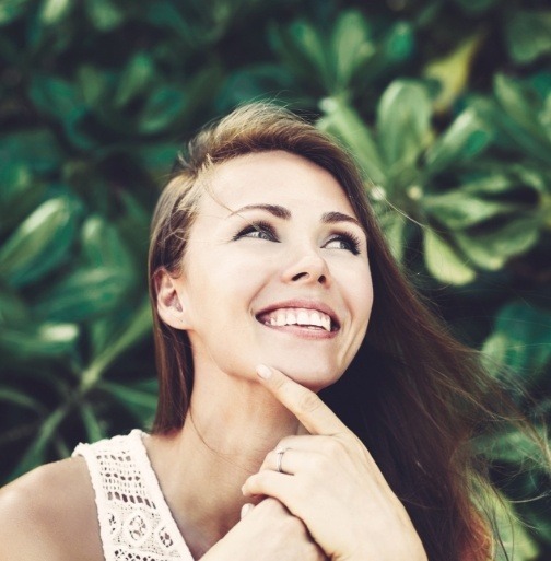 Woman showing off smile after dental bonding