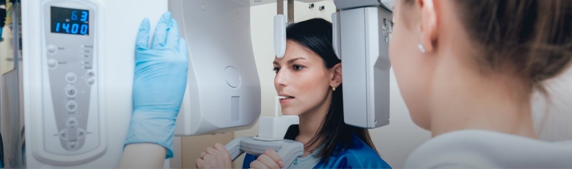 Woman receiving 3 D C T cone beam x-ray scans