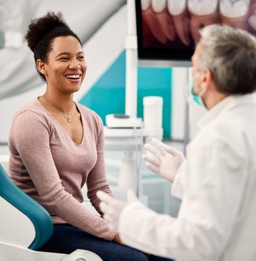 Dentist talking to dental patient