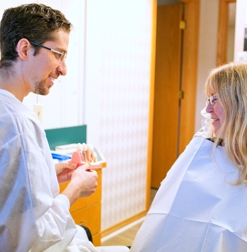 Doctor Korwin talking to dental patient
