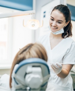 Dental team member smiling at patient