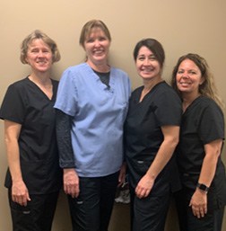 Four dental team members
