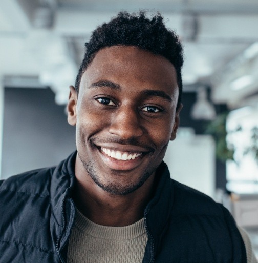 Man with attractive smile after Invisalign treatment