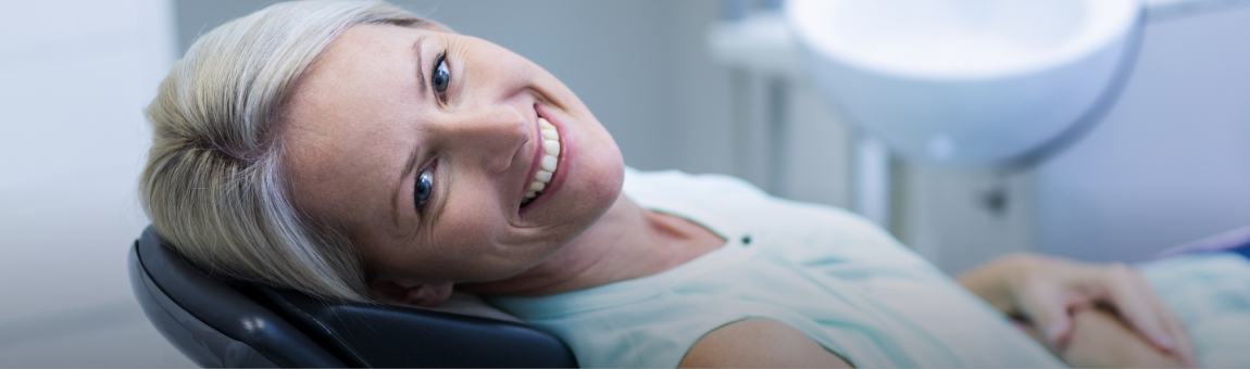 Woman smiling after preventive dentistry