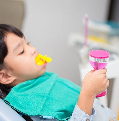 Child receiving fluoride treatment