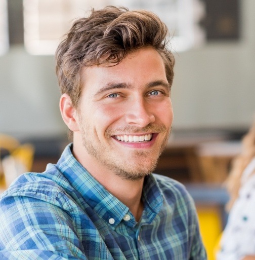 Man smiling after root canal therapy 