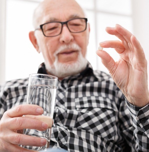 Man holding oral conscious dental sedation pill