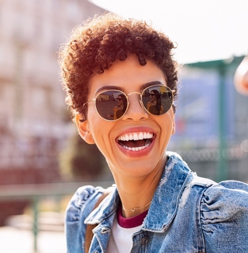 Woman with bright smile after teeth whitening