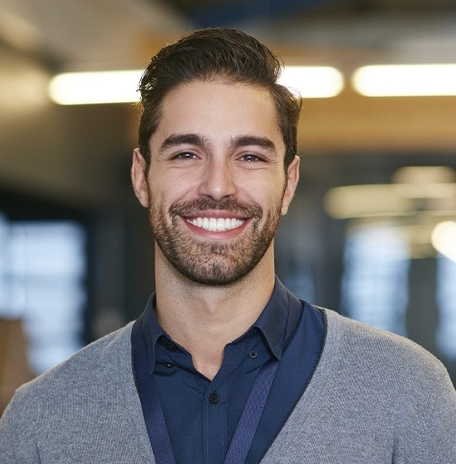 Man sharing bright smile after teeth whitening