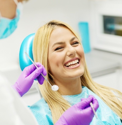 Woman smiling after tooth extraction