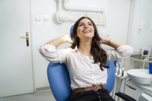 Woman smiling and relaxing in the dental chair