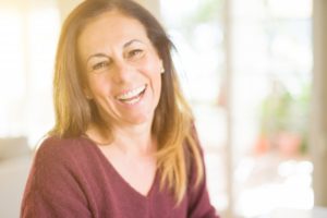 Woman smiling with dental implants