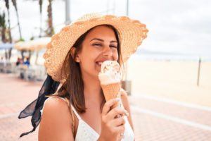 Woman eating an ice cream cone outside