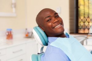 Young man smiling in dental chair