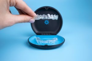 an aligner being placed in its case